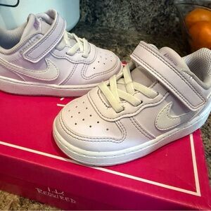 Unworn toddler Nike lilac and white sneakers